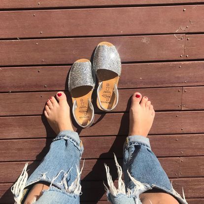 Silver Glitter Ladies leather sandal on decking